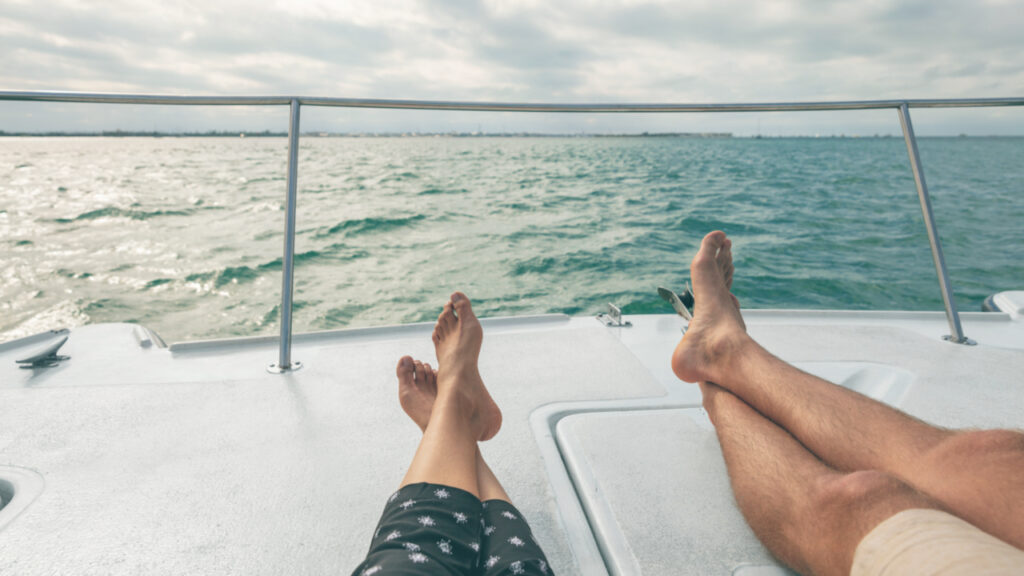 couple resting on yacht